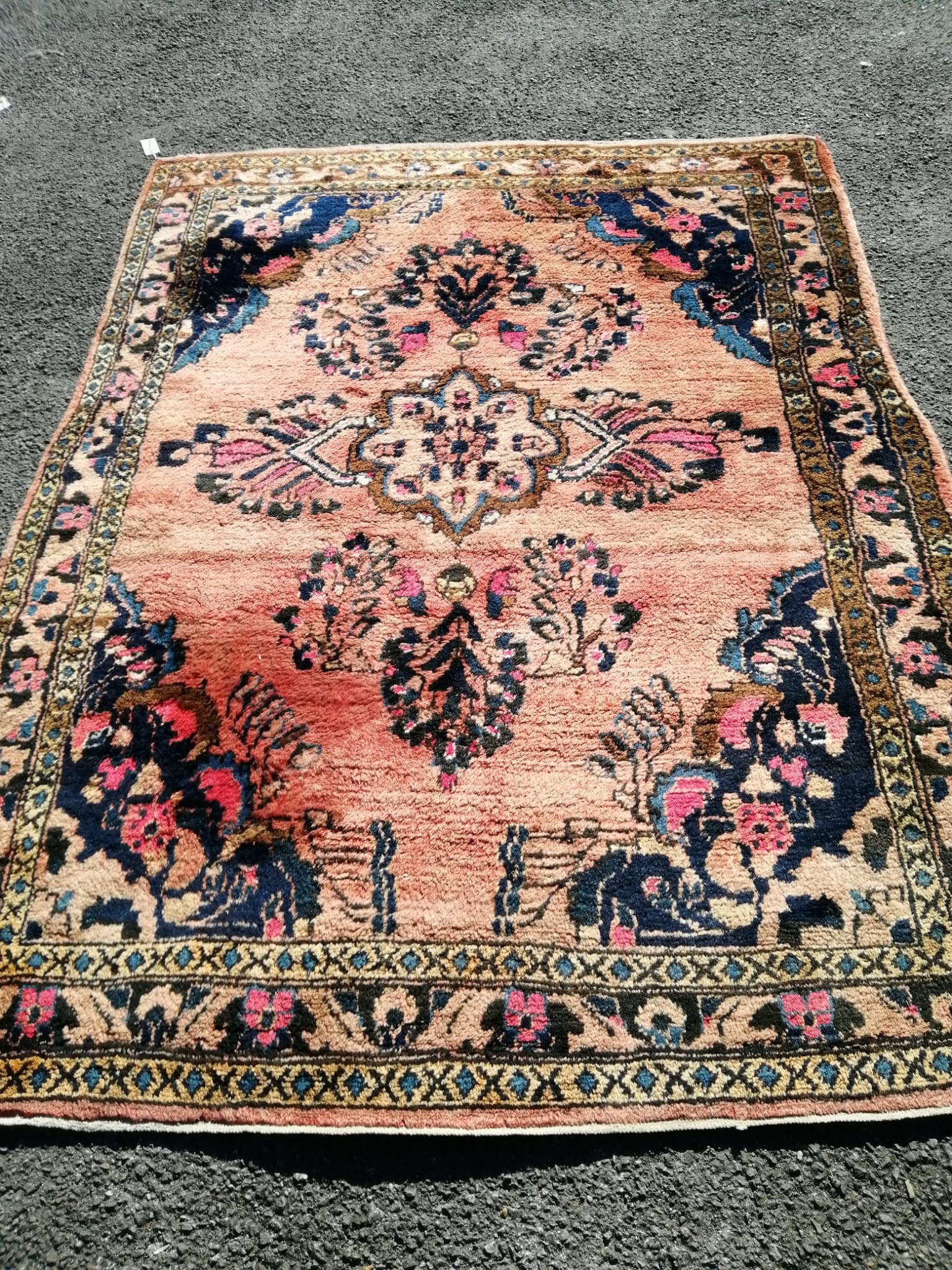 A North West Persian red ground rug, 210 x 150cm